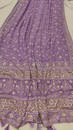 Chikankari Georgette fabric with hand gotapati work and katdana work. Eid Georgette Pre-draped Saree With Gota Work, Festival Chanderi Pre-draped Saree With Gota Work, Festival Chinon Pre-draped Saree With Dori Work, Festival Banarasi Silk Pre-draped Saree With Gota Work, Eid Gota Work Pre-draped Georgette Saree, Purple Chanderi Traditional Wear With Dori Work, Diwali Pre-draped Saree With Chikankari Embroidery In Chinon, Festive Georgette Traditional Wear With Gota Work, Purple Embroidered Georgette Fabric Saree