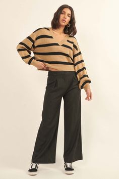 Striped knit sweater. Banded V neckline. Long bishop sleeves. Drop shoulder. Ribbed neckline, cuffs, and hem. Cropped length. Relaxed fit. 100% Acrylic. Imported. Designed in LA. Model wears size S. Trendy V-neck Sweater For Work, Chic Textured Knit V-neck Cropped Sweater, Chic V-neck Cropped Sweater For Spring, Chic Fine Knit V-neck Sweater For Fall, Trendy V-neck Sweater For Workwear In Fall, Chic Stretch V-neck Sweater For Fall, Chic V-neck Sweater With Ribbed Cuffs For Spring, Chic Textured Knit V-neck Sweater For Fall, Chic Ribbed Sweater For Work