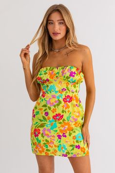 Ready for a dose of vacation bliss? Our Vacay Vibes Mini Dress is your ticket to a stylish getaway! Pack this must-have mini dress for your next adventure, and let it be a reminder of sun-kissed days and unforgettable memories. 100% Polyester Color: Lime Green Floral Print Strapless Back Tie Tube Style Mini Length Vacay Vibes, Kiss Day, Green Floral Print, Green Mini Dress, See You Again, Tube Dress, Sun Kissed, Floral Mini Dress, Egift Card