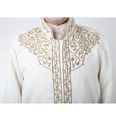 Men's Embroidered Turkish Cubbe Islamic Thobe - White This thobe is intricately designed with beautiful details and modern cuts! Features an embroidered short mandarin collar, has a hidden button down closure design, loose sleeves and inside chest pocket. This thobe will keep you looking smooth and sophisticated. Great for special occasions such as Eid, Ramadan, Weddings and more! FEATURES: Mandarin collar Hidden closure with partial button down Nylon lining with an inside chest pocket Gold Embr Thobes Men, Sports Hijab, Small Wall Decor, Eid Ramadan, Islamic Wall Decor, Hijab Pins, Islamic Decor, Closure Design, Childrens Rugs