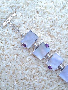 Mother-of-Pearl Bracelet Rectangular w/ Oval Amethyst: WHOLESALE! $395. • Sterling Silver Mother-of-Pearl Bracelet Rectangular w/ Oval Gemstones Rectangular Style Medium size Oval Amethyst Bezel Set Size: 6-Links •  #MartaHowell #MartaHowellJewelry #MotherofPearlBracelet #MotherofPearlJewelry #SilverShellJewelry #SterlingSilverJewelry Abalone Bracelet, Designers Jewelry Collection, Designer Silver Jewellery, Abalone Earrings, Jewelry Styles, Mother Of Pearl Jewelry, Jewelry Catalog, Shell Jewelry, Jewelry Designer