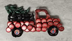 a red toy truck with lots of wheels