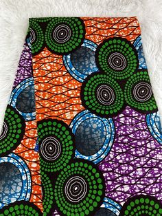 This multicolor African Fabric is high quality African print made from 100% cotton and it's 45 inches wide. It is used for making African Clothing, African quilts, & For Home decoration. FYI: Print is Double sided. The listing is for 1, 6 yards and Headwrap Each piece of fabric measures:  36in by 45in for 1 yard 216in by 45in for 6 yards 70in by 22in for Head wrap If you purchase more than one yard, you will receive one continuous piece. *If you require more than what I have listed, feel free to send me email. CARE INSTRUCTIONS: *DO NOT BLEACH *Hand wash with cold water and mild soap or Dry clean *Press with hot iron for a crispy look. Color may be different due to your monitor Colorful Cotton Digital Prints, Multicolor Print Fabric, Multicolor Ankara Fabric For Traditional Styles, Traditional Multicolor Printed Art, Multicolor Batik Print On Ankara Fabric, Traditional Multicolor Ankara Fabric And Notions, Traditional Green Fabric With Colorful Pattern, Green Traditional Fabric With Colorful Pattern, Traditional Ankara Fabric In Multicolor