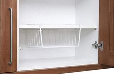 an open cabinet with two shelves and one shelf on the door is shown in this image