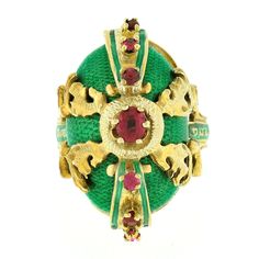 "You are looking at a unique and truly magnificent vintage ring crafted in solid 14k yellow gold. The ring displays the most beautiful and attractive green enamel work that covers the domed top with wonderful textured solid gold underneath the enamel. It is then elegantly adorned with outstandingly detailed gold work set above, in which is perfectly accented with 7 of the most gorgeous natural ruby stones that are well matched with a rich and vibrant pinkish-red color, showing amazing shine due Antique Yellow Gold Emerald Ring, Antique Emerald Ring In Yellow Gold, Ceremonial Yellow Gold Emerald Heirloom Ring, Unique Yellow Gold Enamel Ring For Formal Occasions, Ceremonial Heirloom Yellow Gold Emerald Ring, Unique Yellow Gold Enamel Ring For Anniversary, Victorian Style Hallmarked Enamel Ring For Anniversary, Victorian Yellow Gold Enamel Ring For Anniversary, Ceremonial Heirloom Enamel Ring In Yellow Gold