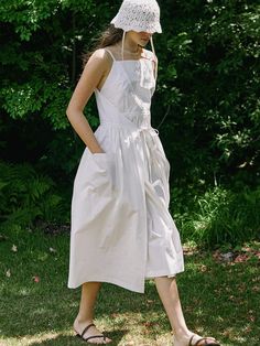 This is a trendy and casual dress by NONLOCAL that is made out of high quality and sturdy material. With distinctive mood of the design and comfortable wear, you can style it for your casual daily outfit.- Unique ribbon strap and shirring detail- Adjustable size and silhouette- Side out pockets on the skirt White Spring Suspender Dress With Adjustable Straps, Spring White Suspender Dress With Adjustable Straps, White Suspender Dress With Adjustable Straps For Spring, Casual Suspender Dress With Pockets For Summer, Casual Summer Suspender Dress With Pockets, White Cotton Suspender Dress For Spring, White Sleeveless Cotton Suspender Dress, White Ruched Sleeveless Dress For Summer, Casual Spring Suspender Dress With Tie Straps