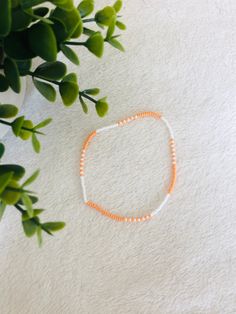 This orange beaded summer anklet is a cute accessory for any outfit and adds a pop of colour. It makes a great gift  for teens and adults. Trendy Colorful Beaded Anklets As Gift, Handmade Orange Casual Friendship Bracelet, Casual Handmade Orange Friendship Bracelets, Casual Handmade Orange Friendship Bracelet, Trendy Tiny Beads Anklets For Summer, Trendy Summer Anklet With Tiny Beads, Trendy Summer Anklets With Round Beads, Trendy Summer Friendship Bracelets With Tiny Beads, Trendy Orange Friendship Bracelets As Gift