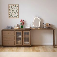 a room with a table, mirror and other items on the shelf in front of it