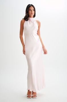 Exude elegance.Make a statement in our ESTHER Iridescent Satin Cowl Maxi Dress, a captivating blend of elegance and allure. Featuring a cowl halter neckline that beautifully frames the décolletage and a low v-back that exudes sophistication, this dress is designed to turn heads. Adorned with self-covered buttons at the back and a side invisible zip for ease of wear, it combines practicality with style. Lined for comfort and a relaxed fit for effortless movement, this dress is the epitome of understated glamour. Elegant Backless Halter Dress For Formal Occasions, Elegant Formal Backless Halter Dress, Elegant Formal Halter Dress, Elegant Silk Halter Cocktail Dress, Glamorous Cowl Back Wedding Dress, Elegant Prom Dress With Cowl Back, Glamorous Wedding Dress With Cowl Back, Chic Bias Cut Halter Dress For Wedding, Glamorous Silk Halter Dress For Formal Occasions