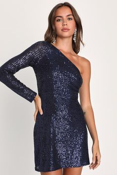 Being the life of the party is easy with a remarkable look like the Lulus All Time Shine Navy Blue Sequin One-Shoulder Mini Dress! Glittering sequins dazzle across a stretchy mesh overlay (atop a matching knit liner) that shapes a trendy one-shoulder neckline and a sheer long sleeve. The fitted waist tops a flirty bodycon skirt that finishes at a modern mini hem. Hidden side zipper/clasp. Fit: This garment fits true to size. Length: Mid-thigh. Size medium measures 32" from shoulder to hem. Bust: Off-shoulder Sequin Party Dress, Off-shoulder Contrast Sequin Party Dress, One Shoulder Sequined Bodycon Dress For Night Out, Off-shoulder Party Dress With Contrast Sequin, Holiday Party Off-shoulder Sequin Dress, Stretch One Shoulder Dress For Party, Blue One Shoulder Party Dress, Glamorous Off-shoulder Sequin Dress For Party Season, Blue Asymmetrical One Shoulder Party Dress