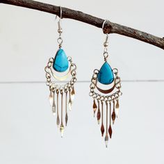 These pretty handmade boho earrings incorporate a turquoise stone and come with Silver plated hooks. These beautiful earrings have been hand made in Peru and are presented in a recycled sari pouch, gift wrapped and ready to give. Approx. 60mm drop Handmade and Fairtrade from Peru Please note: The earrings may vary slightly from the picture as they are handmade, so slight natural variations should be expected. Traditional Turquoise Danglers For Gift, Bohemian Sterling Silver Teardrop Earrings, Bohemian Sterling Silver Chandelier Earrings, Bohemian Sterling Silver Chandelier Earrings For Festivals, Handmade Teardrop Earrings For Festival, Bohemian Teardrop Sterling Silver Chandelier Earrings, Bohemian Sterling Silver Teardrop Chandelier Earrings, Turquoise Chandelier Dangle Earrings For Festivals, Bohemian Turquoise Jewelry Fair Trade