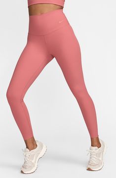 Lightweight InfinaSoft fabric enhances the smooth, freeing feeling of softly ribbed leggings that are ideal for workouts, hangouts and everyday wear. 25" inseam; 8" leg opening; 10 1/2" front rise; 13" back rise (size Medium) Pull-on style Back drop-in pocket Dri-FIT moisture-wicking technology Lined gusset 77% nylon, 23% spandex Machine wash, line dry Imported Versatile Solid Workout Tights, Versatile Workout Tights, Nike Stretch Sporty Yoga Pants, Nike Stretch Bottoms For Workout, Stretch Nike Bottoms For Workout, Nike Stretch Workout Bottoms, Nike Sporty Leggings For Gym, Nike Compressive Workout Bottoms, Stretch Nike Workout Bottoms