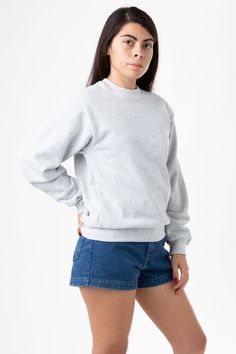 Made from a luxurious 14oz fleece, this crewneck is incredibly soft and warm, yet still breathable and moisture-wicking. The loose fit allows for a full range of motion, making it perfect for everything from running errands to lounging around the house. The ribbed cuffs and hem keep the cold out. This crewneck is Piece Dyed. Our piece-dyed crewneck sweaters fabric is dyed before they're cut and sewn, which results in a more uniform color distribution throughout. This means you'll get a crewneck Plain Crewneck, Los Angeles Apparel, Garment Industry, White Crew Neck, Cute Sweatshirts, Fleece Sweater, Jumper Sweater, White Sweatshirt, Crewneck Sweater