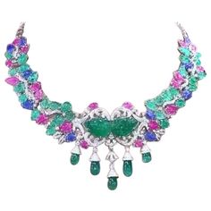 A master piece necklace , so magnificent , refined and chic style, for glamour ladies, by Italian designer, a very piece of art. Necklace come in 18k with 2 centre natural Untreated Carving Zambian Emeralds of 22 carats, extra fine quality; 29 pieces of Untreated Carving Zambian Emeralds of 26 carats, extra fine quality; 5 pieces of natural Zambian Emeralds in perfect drop cut of 24 carats; 10 pieces of Untreated Carving Burma Sapphires , extra fine quality, of 13 carats; 19 pieces of natural Untreated Carving Burma Rubies , extra fine quality, of 17 carats, and 585 pieces of natural diamonds in round brilliant cut of 6,43 carats, F color VS clarity, top quality. I can customize also length on request. Piece of high jewelry. Handcrafted by artisan goldsmith . Excellent manufacture and qual Rubies Necklace, Master Piece, Zambian Emerald, Estilo Chic, Italian Designer, Sapphire Necklace, Stone Design, Zambia, High Jewelry