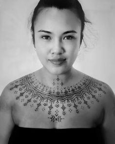 a woman with a tattoo on her chest