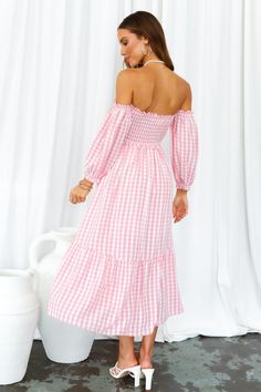 Length from neckline to hem of size S: 101cm. Pink gingham midi dress. Partially lined. Cold hand wash only. Model is a standard XS and is wearing size XS. True to size. Shirred, stretchy top. Lightweight, non-stretchy woven fabric. Adjustable shoulder straps. No zipper. Slip-on style. Rayon. Live the cottagecore dream in our Kiss Me At Sunset Midi Dress! With a sweet gingham print, off-the-shoulder sleeves and ruffled skirt, you'll be running away for a countryside life this summer. Don't forget to style yours with tousled waves, lace-up sandals and a woven bag. Spring Plaid Midi Dress Knee-length, Long Sleeve Ruffled Dress For Picnic, Fitted Knee-length Midi Dress For Picnic, Knee-length Ruffled Midi Dress For Picnic, Knee-length Plaid Dress For Brunch, Gingham Maxi Dress For Picnic, White Midi Dress For Picnic, Feminine Plaid Spring Dress, Spring Picnic Plaid Midi Dress