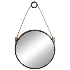 a round mirror hanging from a rope