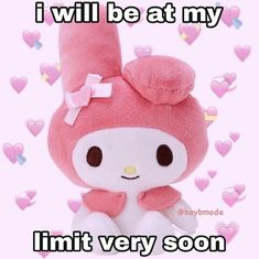 a pink stuffed animal sitting on top of a white surface with hearts around it and the caption i will be at my limit very soon