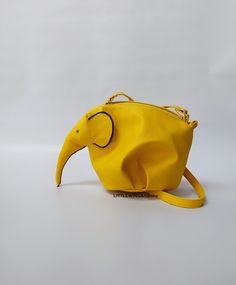 ♥Limited edition! This listing is for one lemon-yellow ECO leather elephant bag! One of the best accessories bohemian cross-body bag is truly unique! Perfect for your personal objects, coins, decorative objects, jewelry, or other valuable items and accessories such as electronic devices (smartphones, chargers...) This clutch is very strong and durable, fashionable, classic but very stylish, perfect for your daily life, for a unique look, special occasions or events, etc. This is my favorite purs Yellow Pouch Bag For Mobile Phone, Yellow Pouch Shoulder Bag With Mobile Phone Pocket, Yellow Handheld Bags For Daily Use, Handheld Yellow Bags For Daily Use, Yellow Handheld Satchel For Travel, Yellow Crossbody Bag Gift, Yellow Mobile Phone Bag As Gift, Yellow Bag With Removable Pouch As A Gift, Yellow Bags With Removable Pouch As Gift