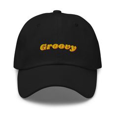 Step back in time with this retro 'Groovy' embroidered black cap, the perfect accessory for any vintage enthusiast. Crafted with high-quality materials, this classic dad hat combines modern comfort with a nostalgic flair. The vibrant yellow and orange 'Groovy' text stands out beautifully against the sleek black fabric, making it a stylish addition to any casual outfit. Features: - High-quality embroidery - Adjustable strap for a perfect fit - Comfortable and durable fabric - Ideal for casual wea Retro Streetwear Hat With Curved Visor, Retro Curved Bill Dad Hat, Retro Baseball Cap With Curved Visor, Vintage Curved Visor Hat For Streetwear, Retro Dad Hat With Embroidered Logo, Retro Dad Hat For Streetwear, Retro Dad Hat For Streetwear With Curved Bill, Retro Visor Hat With Embroidered Logo, Retro Dad Hat With Curved Visor For Streetwear