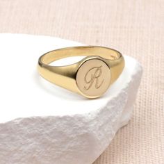 PRODUCT DESCRIPTION * Our Ladies 9ct Yellow Gold Personalised Round Signet Ring can be personalised with an initial to create a bespoke gift that can be worn every day. * Crafted from solid 9ct gold, its classic round design makes it suitable for ladies and women of all ages. *This engraveable signet ring becomes a unique and cherished keepsake, making it an ideal personalised gift. Treat yourself to a touch of luxury or surprise a loved one with this solid gold symbol of sentiment. Discover the Personalized Engraved Rose Gold Ring, Classic Personalized Rose Gold Initial Ring, Rose Gold Signet Ring With Initials For Gift, Classic Engraved Ring With Hallmarks As Gift, Classic Engraved Ring With Hallmarks For Gift, Personalized 14k Gold Initial Ring, Personalized Rose Gold Engraved Ring, Classic Engraved Ring For Personalized Gift, Monogrammed Yellow Gold Rings As Personalized Gift