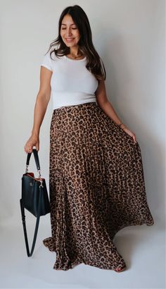 Introducing the Lola Leopard Print Maxi Skirt - the perfect choice for anyone looking to add a little wildness to their wardrobe! This long and pleated maxi skirt features a striking leopard print, making it a fierce and playful addition to any outfit. Leopard Print Maxi - Long Length Runs Big, if in-between sizes we recommend sizing down Lined Elastic Stretch Waist Band Pleated Maxi Skirt Outfit, Leopard Print Maxi Skirt, Maxi Skirt Outfit, Maxi Skirt Outfits, Print Maxi Skirt, Leopard Print Skirt, Pleated Maxi Skirt, Printed Maxi Skirts, Long Midi Dress