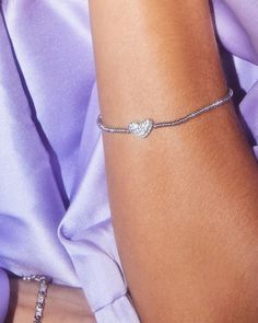 Like wearing your heart on your sleeve? Then the Ari Silver Pavé Heart Stretch Bracelet in White Crystal is perfect for you. Designed to fit any wrist, this minimal-yet-playful bracelet is the easiest way to bring some love and shine to your everyday stacks. Heart On Your Sleeve, Gift Subscription Boxes, Black Leather Bracelet, Blue Outfit, White Crystal, Heart On, Large Tote Bag, Brass Material, Crystal Heart