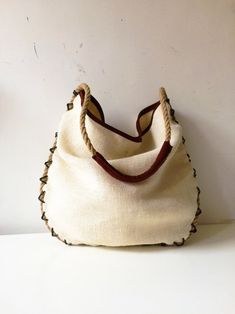 Brown Canvas Bag For Summer, Summer Style Beige Jute Hobo Bag, Brown Summer Canvas Bag With Handles, Beige Jute Summer Hobo Bag, Beige Canvas Bag With Leather Handles For Beach, Summer Beige Jute Hobo Bag, Natural Canvas Summer Bag, Beige Canvas Bag With Handles For Summer, Summer Beige Canvas Bag With Handles