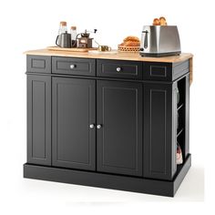 a black kitchen island with wooden top and drawers