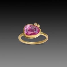 This gorgeous ring features a bright pink rose cut sapphire wrapped in warm 22k gold, and accented with two tiny sparkling white diamonds. This ring is lovely on its own, and stacks beautifully with others in the collection. The setting measures approximately 3/8 inch x 3/8 inch. 1.5mm 18k gold hammered band. Matte finish. This piece is in stock and ready to be sized to fit, if necessary. Gorgeous Ring, Hammered Band, Pink Sapphire Ring, Sparkle Diamonds, 22k Gold, White Diamonds, Pink Sapphire, Rose Cut, Bright Pink