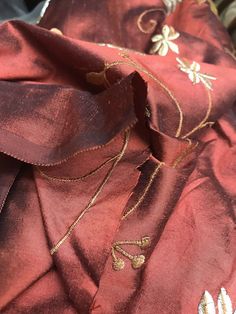 A beautiful Designer 100% Silk Taffeta in the most unique color of Rust Red. Floral embroidery cascades down the face of the fabric. Can be used for upholstery, interior decorating, or coat and skirts garments. Sold by the yard. 55” wide. Will combine shipping. Photo of the drapes are for inspirational purposes only, they are not made of the actual fabric but of similar fabric. The photos of the fabric is the actual fabric being sold. Check out more of our designer and runway fabrics by visiting Luxury Slub Silk Embroidered Fabric For Diwali, Luxury Silk Fabric With Resham Embroidery, Exotic Dramatic, Silk Taffeta, Embroidery Floral, Floral Fabric, Red Floral, Unique Colors, Sale Design