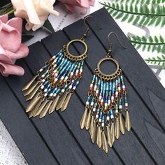 Fashion Round Cutout Creative Beizhu Tassel Bohemian Earrings – rrdeye Pretty Accessories, Cheap Earrings, Beaded Tassel Earrings, Rice Bead, Casual Jewelry, Long Drop Earrings, Popular Jewelry, Long Dangle Earrings, Bohemian Earrings