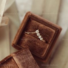 an engagement ring in a velvet box