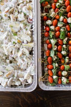 two trays filled with different types of food