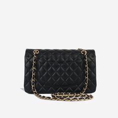 For timeless Parisian-chic there is no better investment than a Chanel classic flap bag. Created in black lambskin leather in the coveted medium size remains the all-time best-seller at bagsalora. This Chanel comes with all the iconic features including multiple compartments and pockets. The interwoven chain sits elegantly on your shoulder or doubled up on your arm. SPL Exterior Black lambskin leather exterior Gold-tone hardware Double flap CC Twist lock closure Slip pocket at rear of bag 2019 production Immaculate condition - minor markings to base Interior Burgundy leather interior Zip compartment on first flap Two slip pockets at interior wall Immaculate condition Sold with box, dust bag and ity card SPL Height 16cm Width 26cm Depth 7cm Chanel Classic Flap Bag, Classic Flap Bag, Parisian Chic, Timeless Handbag, Luxe Fashion, Classic Flap, Exclusive Bag, Medium Bags, Flap Bag