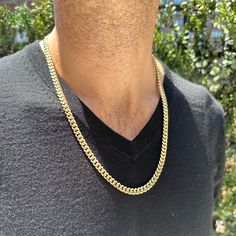 A bold gold moment for our SG Men. The Men's Cuban Link Chain necklace is a classic and timeless piece of jewelry featuring closely interlocked, flattened links that create a sleek and substantial appearance. Available in 14K Yellow Gold Chain thickness = 6.45mm Chain length = 24in Gold Cuban Link Necklace In 14k Solid Construction, Modern Necklace With Solid Cuban Link Construction, Modern Gold Cuban Link Chain Necklace, Modern Cuban Link Gold Chain Jewelry, Classic Cuban Link Jewelry With Polished Finish, Formal Cuban Link Necklace With Figaro Chain, Modern 14k Gold Cuban Link Jewelry, Modern Gold Cuban Link Necklace, Classic Cuban Link Necklace With Polished Finish