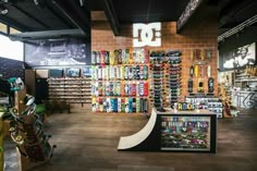 the inside of a skateboard shop with lots of products