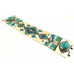 Chili Rose Beaded Turquoise & Gemstone Bracelet by Adonnah Langer of Santa Fe, New Mexico Gorgeous Diana Bracelet features a Southwestern blend of turquoise, olive green and red Swarovski beads handcrafted with a true artistic mix of beads and a canvas of gorgeous colors. Gorgeous Turquoise Oval Medallions Grace the ends of this woven beaded bracelet *Measures 6 3/4 inches to 7 1/2 inches- please specify (made to order) *Medallion measures 1 1/4 inch x 7/8 inch *Sterling Silver .925 *Hidden Lock Artisan Turquoise Beaded Cuff Bracelet, Artisan Beaded Turquoise Cuff Bracelet, Turquoise Beaded Fusion Jewelry, Artisan Blue Beaded Bracelets, Traditional Turquoise Bracelet With Inlay, Handmade Artisan Turquoise Beads, Handmade Southwestern Green Cuff Bracelet, Handmade Artisan Turquoise Cuff Bracelet, Handmade Turquoise Artisan Cuff Bracelet