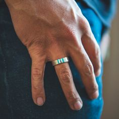 Tradition meets modern minimalism with our Trinity turquoise ring. Inspired by the intricate art of inlay, this piece is a reimagined version of our beloved Infinity Ring, now boasting a wider band and thicker turquoise. Designed for the minimalist, it's sleek silhouette exudes understated elegance, making it perfect for everyday wear. Sterling Silver Ring Natural Turquoise Inlay 1/4" Width Satin Finished Modern Rings With Thick Band And Tension Setting, Modern Adjustable Ring With Tension Setting, Minimalist Polished Promise Band, Modern Bands With Smooth Bezel For Everyday, Modern Wide Band Ring For Wedding, Modern Everyday Bands With Smooth Bezel, Minimalist Stainless Steel Jewelry With Brushed Finish, Modern Adjustable Tension Setting Ring, Modern Adjustable Tension Set Rings