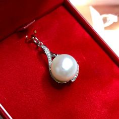 "Jewelry is the one thing that has the power to make you feel absolutely unique and elegant. Dazzle yourself and everyone around you with this cute and lustrous South Sea Pearl pendant. Featuring a RARE, LUSTROUS 12 mm Natural, Round, White South Sea Pearl, accented by 15 pieces of Brilliant Round diamonds weighing at 0.10 carat. Set in 18K solid white gold, handcrafted by professional goldsmith. All gems have been selected and graded for their unsurpassed quality and authenticity. FOR MATCHING Elegant Round Pearl Necklace For Gift, Exquisite Akoya Pearl Necklace For Gift, Exquisite Akoya Pearl Necklace Gift, Fine Jewelry White Gold Pearl Pendant Necklace, White Gold Akoya Pearl Pendant Jewelry, Exquisite Pearl White Pearl Necklace Gift, Exquisite Pearl White Pearl Necklace As Gift, Exquisite Pearl White Pearl Necklace For Gift, Fine Jewelry Pearl Necklace As Gift