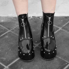 Step into edgy elegance with our Noir Platform Boots from the original Hesed Blackout collection.  Handcrafted by Salvadoran artisans, these round-toe ankle boots feature a 9cm heel at the back and 4cm platform at the front. Made from high-quality black faux patent leather, including a sole lining. Adorned with silver rivets, they open with a ring pull zipper. Customize colors and sizes. Perfect for casual outings, cosplay, or striking photo shoots. Please note that this product is shipped from Rocker Boots, Edgy Elegance, Gothic Emo, Style Rock, Rocker Style, Vegan Shoes, Platform Boots, Rivets, Boot Shoes Women