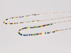 Quirky, modern, and super cool. African glass beads on a 14k Gold Open Link Chain. Available in 14k yellow gold. Made in the USA All CH jewelry is made to order. Please allow up to 10 business days for your item(s) to ship. Modern Jewelry With Colorful Beads, Modern Colorful Beads Jewelry As Gift, Modern Jewelry With Colorful Beads For Gifts, Modern Colorful Beaded Jewelry As Gift, Modern Colorful Beaded Jewelry For Gifts, Modern Jewelry With Beaded Round Beads Chain, Modern Glass Beaded Jewelry, Modern Single Strand Round Bead Jewelry, Modern Single Strand Jewelry With Round Beads