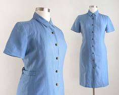 Vintage 90s blue sheath dress that is entirely button down. It has short sleeves, round bronze buttons down the front, and waist straps on each side that can be adjusted for fit. The dress has light shoulder padding and is fully lined with light blue polyester fabric. Brand: Kasper Size: marked size 14 but please use the measurements below to ensure an accurate fit. Fabric: 55% linen, 45% rayon Care: dry clean Condition: good vintage condition Measurements: Bust: 43" Waist: 37" Hip: 44" Length: Fitted Linen Shirt Dress For Work, Fitted Linen Shirt Dress For Formal Occasions, Formal Fitted Linen Shirt Dress, Fitted Linen Button-up Shirt Dress, Fitted Linen Shirt Dress For Daywear, Fitted Linen Knee-length Shirt Dress, Blue Fitted Shirt Dress With Button Closure, Fitted Blue Shirt Dress With Button Closure, Fitted Cotton Shirt Dress With Buttons