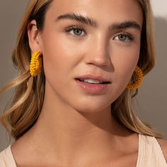 Make a statement this summer with our Beaded Hoops. These dark yellow beaded earrings pair perfectly with all of your favorite gold earrings and all of our other beaded jewelry. Add these statement hoop earrings to your collection and you’ll have an unforgettable look all season long. Yellow Hoop Earrings For Spring, Gold Beaded Hoop Earrings For Summer, Yellow Hoop Earrings For Summer, Gold Beaded Earrings For Beach, Trendy Gold Beaded Earrings For Summer, Trendy Summer Beaded Earrings, Trendy Yellow Beaded Jewelry, Colorful Beads Hoop Earrings For Beach, Yellow Beaded Hoop Earrings For Summer