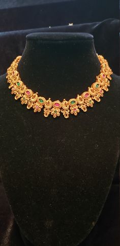 "Handmade Indian Temple Jewelry, best to wear it for traditional ceremonies or Indian wedding. This bridal jewelry has ethnic finish. It has Cubic Zircon stones with ruby and emeralds. It is a Bollywood style one gram jewelry. There are long and short patterns of Indian jewelry in Kundan, Pearls, CZ, American Diamond , ruby, emerald, Polki, kemp to suit every occasion of South Indian and North Indian weddings. Handmade Indian Jewelry item * Stunning Hand made Traditional jewelry set. * Necklace Traditional Hand Set Temple Necklace For Puja, Ceremonial Kundan Necklace Hand Set In Temple Jewelry Style, Ceremonial Kundan Necklace In Temple Jewelry Style, 22k Gold Chandbali Bridal Necklace In Temple Jewelry Style, 22k Gold Meenakari Bridal Necklace In Temple Jewelry Style, 22k Gold Chandbali Bridal Necklace With Pallu, Diwali Temple Jewelry Bridal Necklace In Gold Plated, 22k Gold Kundan Necklace In Temple Style, Gold Plated Round Temple Necklace