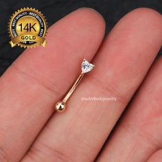 Sold in a single piece Material: 14K Solid Gold (Stamped 14K for Purity Authenticity) 5A Grade Cubic Zirconia Gemstones  Size: Bar Thickness: 16 Gauge (1.2mm) Bar Length: 8mm Top CZ Size: 3-3.8mm You won't miss this heart simple  curved barbell with a glittering gems on it. You will love this little versatile piece for your piercing! 14K Solid Gold Heart Eyebrow Ring/Rook Barbell/Rook earrings/Curved Barbell/Rook Piercing/Eyebrow Piercing/Cartilage Piercing/Gift for her/Mother's day jewelry gift Barbell Jewelry, Piercing Eyebrow, Heart Simple, Piercing Cartilage, Ear Piercings Cartilage, Eyebrow Ring, Facial Piercings, Eyebrow Piercing, Cartilage Earring