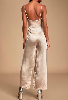 Indulge in ultimate luxury with our Satin Cowl Neck Culotte Jumpsuit. Crafted from gorgeous woven satin, this jumpsuit features a cowl neckline and wide-cut culotte style pants for a chic, sophisticated look. With a darted waist and adjustable straps, it offers a flawless fit for any cup size. Perfect for any occasion, this jumpsuit is a must-have for the fashion-forward. Chic Satin V-neck Jumpsuits And Rompers, Chic Satin Jumpsuits And Rompers In Solid Color, Chic Solid Color Satin Jumpsuits And Rompers, Elegant Satin Jumpsuit Or Romper In Solid Color, Solid Satin Jumpsuits And Rompers For Night Out, Chic Evening Strapless Floor-length Jumpsuit, Chic Strapless Floor-length Jumpsuit For Evening, Chic Floor-length Strapless Jumpsuit For Evening, Spring Evening Satin Jumpsuits And Rompers