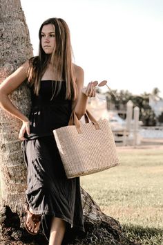 This airy, straw tote bag is finished with natural leather handles and a classic linen lining. Versatile and stylish, it's the perfect partner for airy dresses, summer prints or white denim. Content:- Straw- Leather - Linen Lining- Imported Size:- Width: 18.25" - Height: 12"- Depth: 6.59"- Handle Drop: 4.5" Chic Summer Bags Made Of Natural Fiber, Chic Double Handle Straw Bag, Elegant Bucket Bag With Leather Handles In Natural Color, Elegant Natural Bucket Bag With Leather Handles, Casual Beige Straw Bag With Rolled Handles, Chic Straw Bag With Leather Handles, Chic Summer Straw Bag For Everyday, Chic Everyday Summer Straw Bag, Chic Beach Bag Made Of Natural Fiber