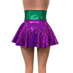 Our newest skirt style! We are in love with this lace-up, open-front mini skirt in purple and green holographic spandex with gold ties/laces. The tie-up front offers an adjustable fit and the skirt is light and airy.This mardi gras corset skirt is perfect for your party or event! The gold holographic cheeky shown in the photo is sold separately in our shop. Fitted Purple Bottoms For Party Season, Club Mini Skirt For Party Season, Stretch Mini Skirt For Club And Party Season, Fitted Green Mini Skirt For Night Out, Rave Style Mini Skirt For Night Out, Purple Mini Skirt For Party, Metallic Stretch Mini Skirt, Metallic Mini Skirt With Stretch, Fitted Green Skirt For Festival