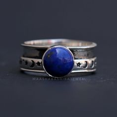 "Lapis Lazuli Spinner Ring, Crescent Moon Ring, 925 Sterling Silver Ring, Celestial Band, Silver Star Ring, Women Spinning Band, Wedding Ring SHOP LINK:- https://www.etsy.com/shop/MaaShabashibaJewell?ref=seller-platform-mcnav 》D E T A I L S《 Metal- 925 Sterling Silver Gemstone: Natural Lapis Lazuli Gem Color: Blue Gem Shape: Round Style- Boho & Hippie Ring Size: All Size Available This One of a kind spinner ring is in sterling silver. Spinner Ring: The spinner ring is believed to come from ancie Celestial Style Adjustable Stackable Rings For Anniversary, Celestial Style Round Band Rings As Gift, Celestial Style Stackable Promise Rings, Celestial Stamped 925 Promise Ring, Celestial Style Promise Ring Stamped 925, Crescent Silver Gemstone Ring, Silver Crescent Gemstone Ring, Crescent Silver Ring With Gemstone, Sterling Silver Moon Phase Jewelry For Promise